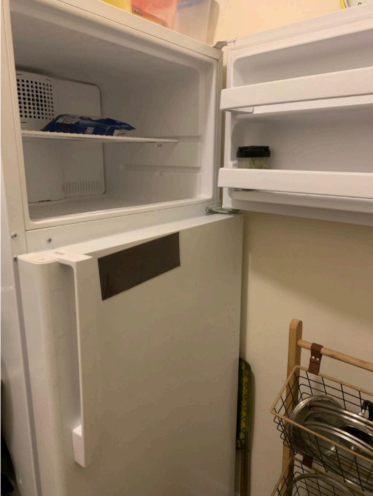 An open, empty refrigerator